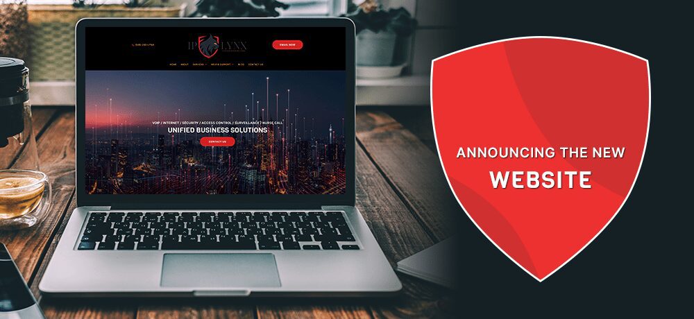 Laptop displaying new website announcement.