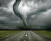 Tornado approaching over a deserted road.