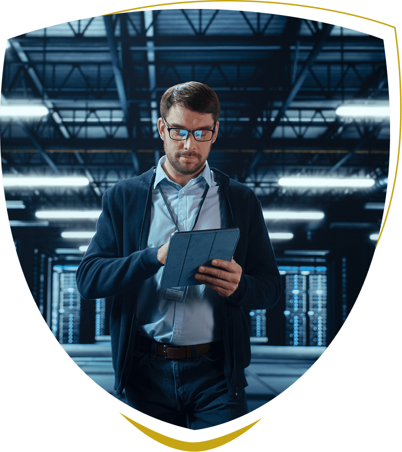 Man using tablet in server room.