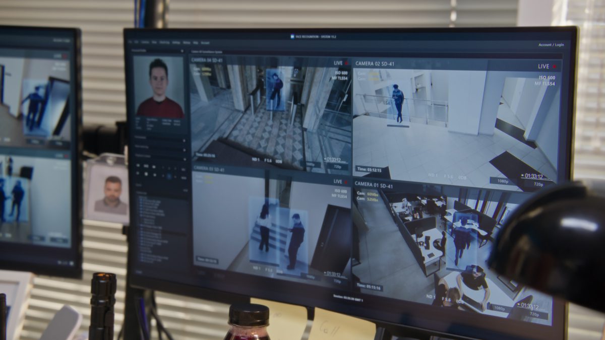 Security surveillance monitors displaying multiple camera feeds.